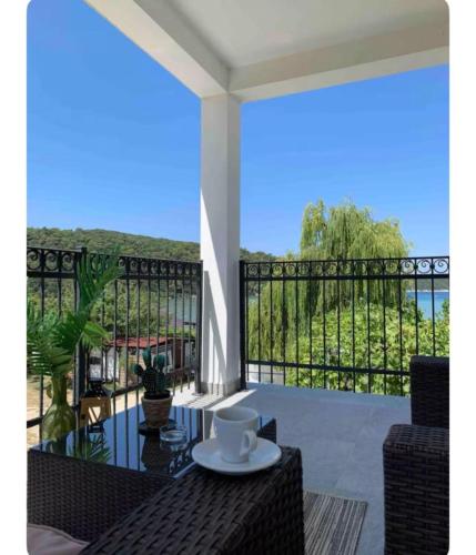 a balcony with a view of the ocean at ''ROOM 6'' - breakfast included in Kampor