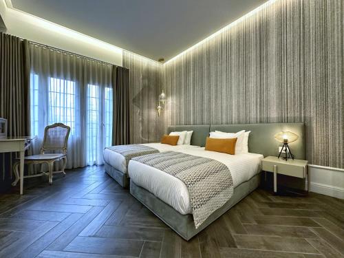 Postel nebo postele na pokoji v ubytování 10 Stories Hotel