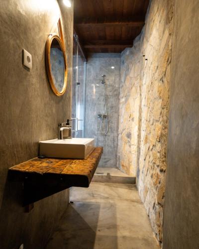 a bathroom with a sink and a shower at Alex Surf Hostel in Baleal