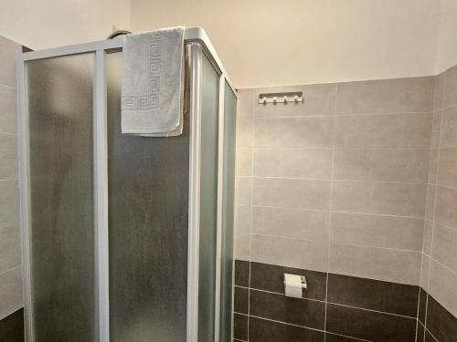 a shower with a glass door in a bathroom at B&B Via Nazionale in Milazzo