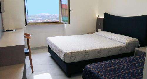 Postel nebo postele na pokoji v ubytování HOTEL HOUSE GARGANO