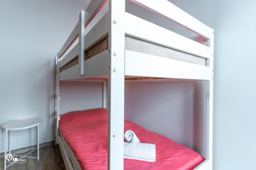 a bunk bed in a small room with a stool at 'Red Port'Amazing House 5 min from the sea in Rafina