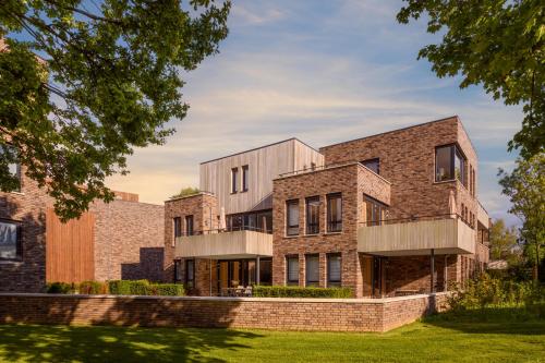 an external view of a brick building at Dormio Resort Maastricht in Maastricht