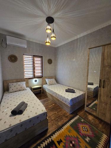 Ένα ή περισσότερα κρεβάτια σε δωμάτιο στο HAVAS Guest House
