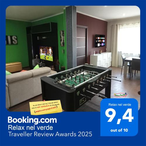 a living room with a large foosball table at Relax nel verde in Bracciano