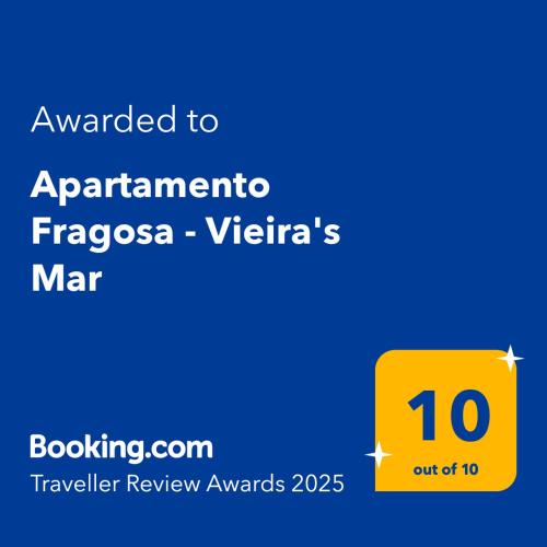 a yellow sign with the text awarded to apartment tropica vyssa viridis at Apartamento Fragosa - Vieira's Mar in Póvoa de Varzim