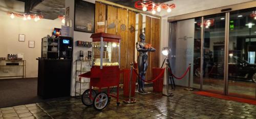 a store with a red cart in a room at Amical Hotel Hagen - Am Hauptbahnhof in Hagen
