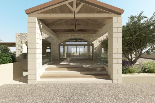 a pavilion with a building with a sky background at The Yard Corfu Boutique Hotel and Spa in Corfu Town