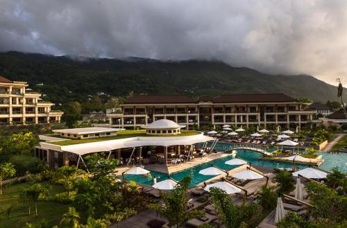an aerial view of a resort with a swimming pool at Savoy Seychelles Resort & Spa in Beau Vallon