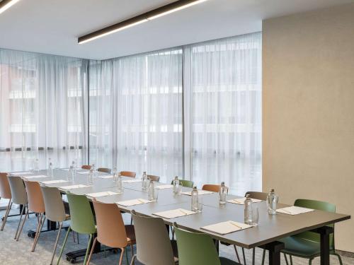 a large conference room with a long table and chairs at Mercure Sofia City in Sofia