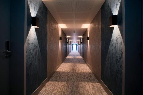 a corridor of a hotel with at Hotel Kiel by MELIO in Kiel
