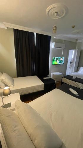 Katil atau katil-katil dalam bilik di Sever Hotel