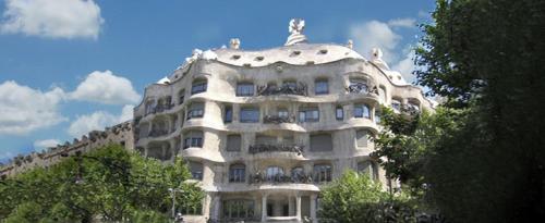 a large white building with balconies on top of it at Hotel Continental Palacete in Barcelona