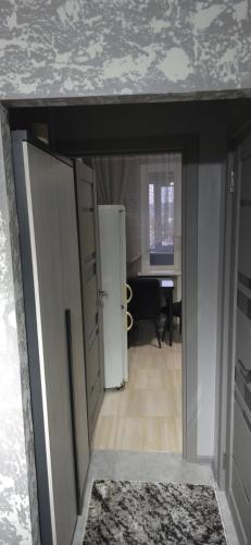a room with a door and a room with a desk at Apartament in Bălţi