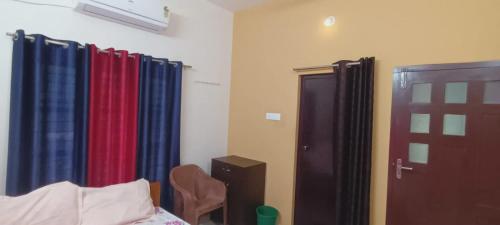 Letto o letti in una camera di Villa Florence Homestay Varkala Cliff