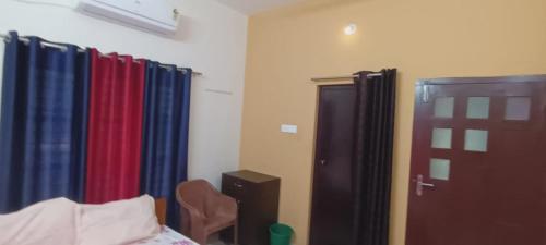 Letto o letti in una camera di Villa Florence Homestay Varkala Cliff