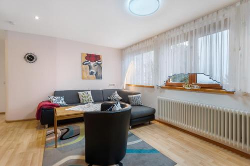 a living room with a couch and a table at Haus Bührer in Freiamt