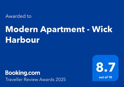 a blue sign with the words modern apartment at Modern Apartment - Wick Harbour in Wick