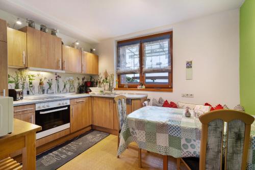 a kitchen with a table and a dining room at Haus Bührer in Freiamt