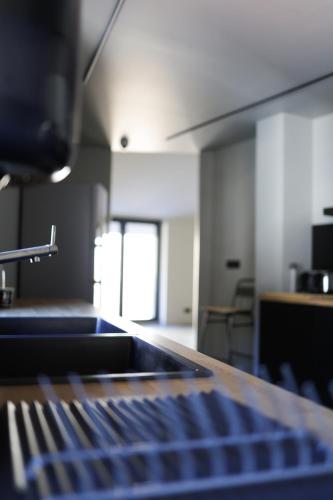 a view of a kitchen with a counter top at KY Mountain Hostel Arinsal in Arinsal