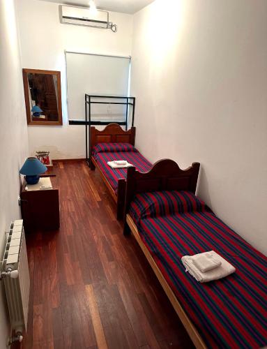 Katil atau katil-katil dalam bilik di Duplex familiar Nivel Superior