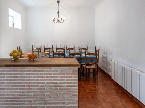 a dining room with a table and chairs at Casa La Regidora in Cinco Casas