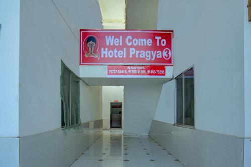 a sign in a hallway of a hospital at Super Hotel O Pragya New in Raipur