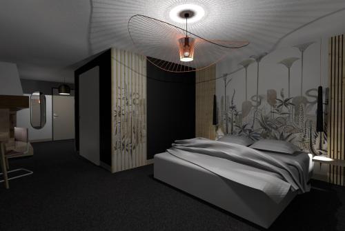 a bedroom with a bed and a ceiling at Domaine du Mont-Saint-Jean in Les Rousses