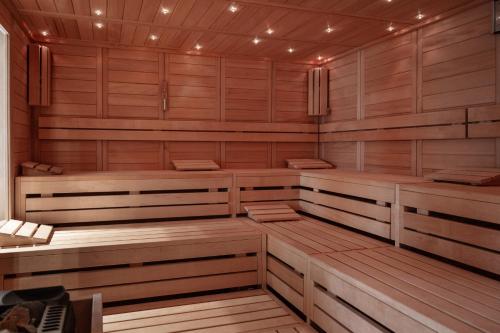 a sauna with wood paneling and lights in it at Gut Brook in Brook