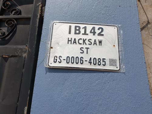 a license plate on the side of a blue wall at New appartement at Weija in Weija