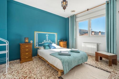 Ένα ή περισσότερα κρεβάτια σε δωμάτιο στο Little Alhambra