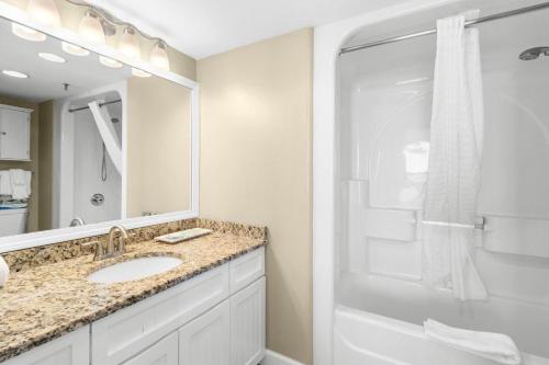 a bathroom with a sink and a shower at 5th Flr Oceanfront 2 Bedroom Condo in Pawleys Island