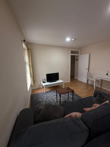 a living room with a couch and a table at Main Street One-Bedroom Apartment in Gibraltar