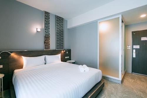 Katil atau katil-katil dalam bilik di One Budget Hotel Lampang Phahonyothin