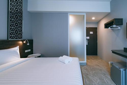 Katil atau katil-katil dalam bilik di One Budget Hotel Lampang Phahonyothin