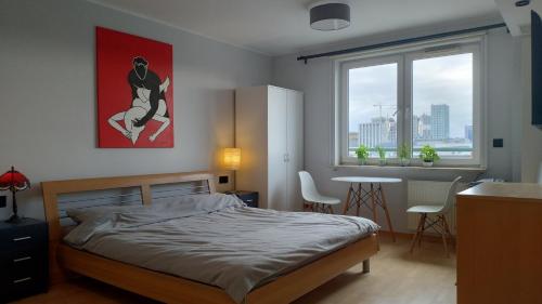 Posteľ alebo postele v izbe v ubytovaní Sunny Apartment Warszawa