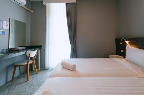 Katil atau katil-katil dalam bilik di One Budget Hotel Lampang Phahonyothin
