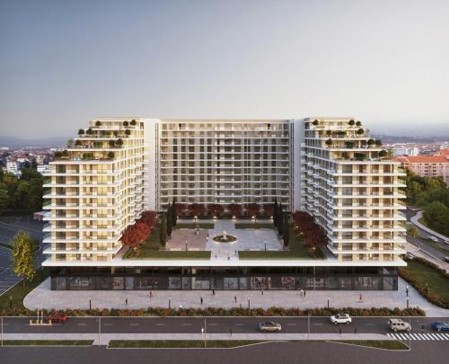 an aerial view of a large building with a courtyard at Planet Lux Apartment in Niš