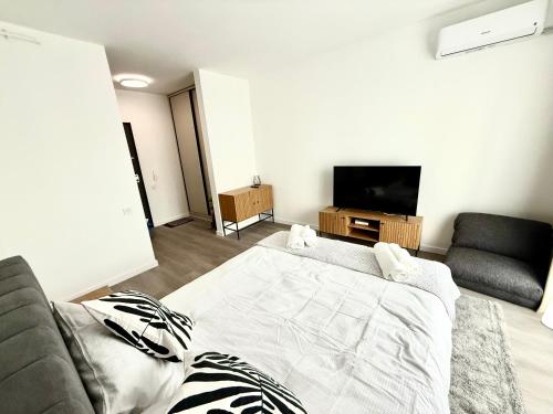 TV a/nebo společenská místnost v ubytování RULU Studio Plaza Mall