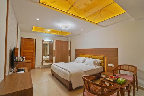 a hotel room with a bed and a table with a table at Island Bay View Inn in Cocoanut Island