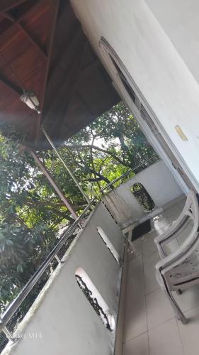 an overhead view of a room with chairs and trees at Chanmira villa in Kelaniya