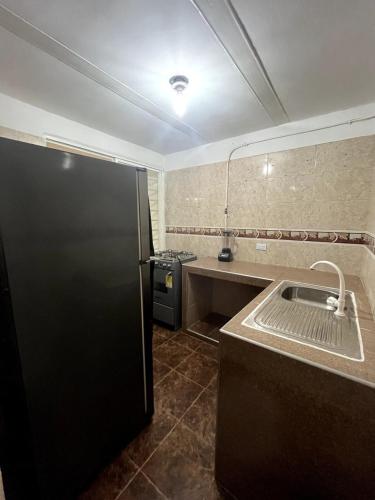 Η κουζίνα ή μικρή κουζίνα στο Acogedor Hogar en Roldanillo