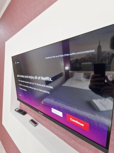 a television screen with a website on it at Familia Apartment in Chişinău