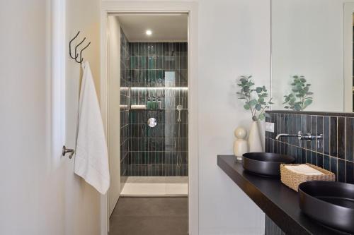a bathroom with a sink and a shower at Factory Apartments Barcelona in Barcelona