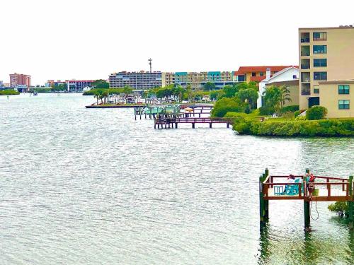 a large body of water with a pier in it at Amazing views & steps to beach 2B-2Bath-Pool 333 in Clearwater Beach