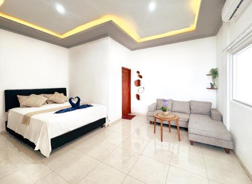 Ένα ή περισσότερα κρεβάτια σε δωμάτιο στο Coco Guest House Canggu