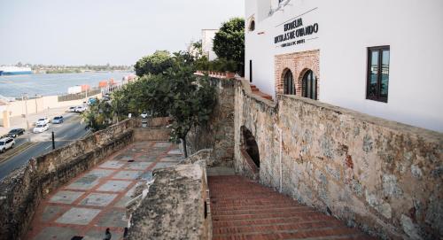 a stairway leading up to a building with a street at Hodelpa Nicolás de Ovando in Santo Domingo