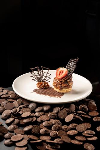a plate of food with chocolate cookies on a table at Hodelpa Gran Almirante in Santiago de los Caballeros