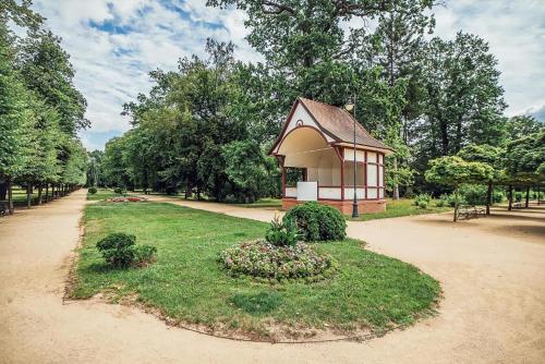 a small building in the middle of a park at Škodova Apartments in Přerov