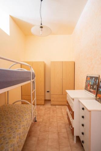 Ένα ή περισσότερα κρεβάτια σε δωμάτιο στο A dieci passi dal Mare